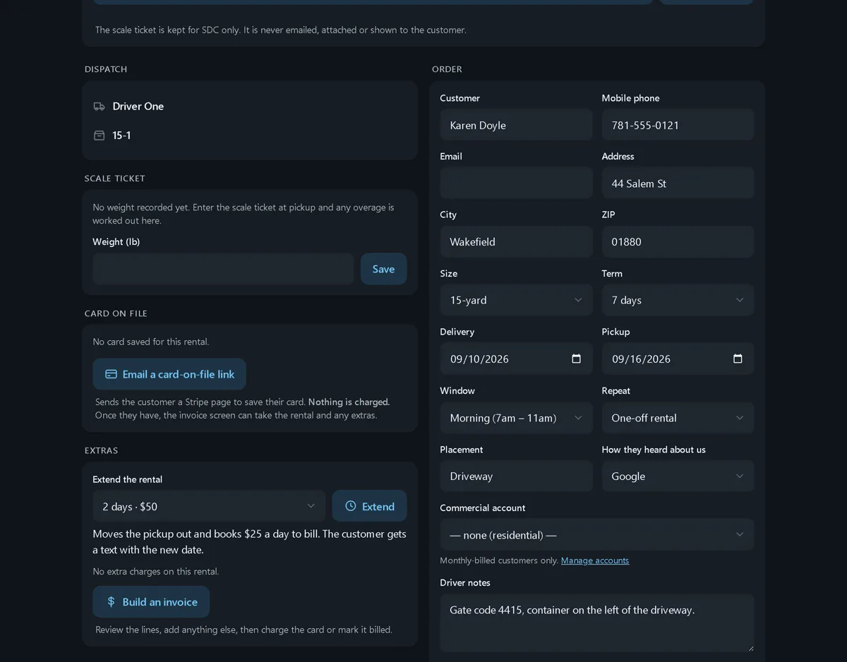 The lower half of a rental page in dark mode: the dispatch card with the driver and container, the scale ticket weight field, a card-on-file card with an Email a card-on-file link button, an extras card with an Extend the rental select and a Build an invoice button, and the order form beside it.